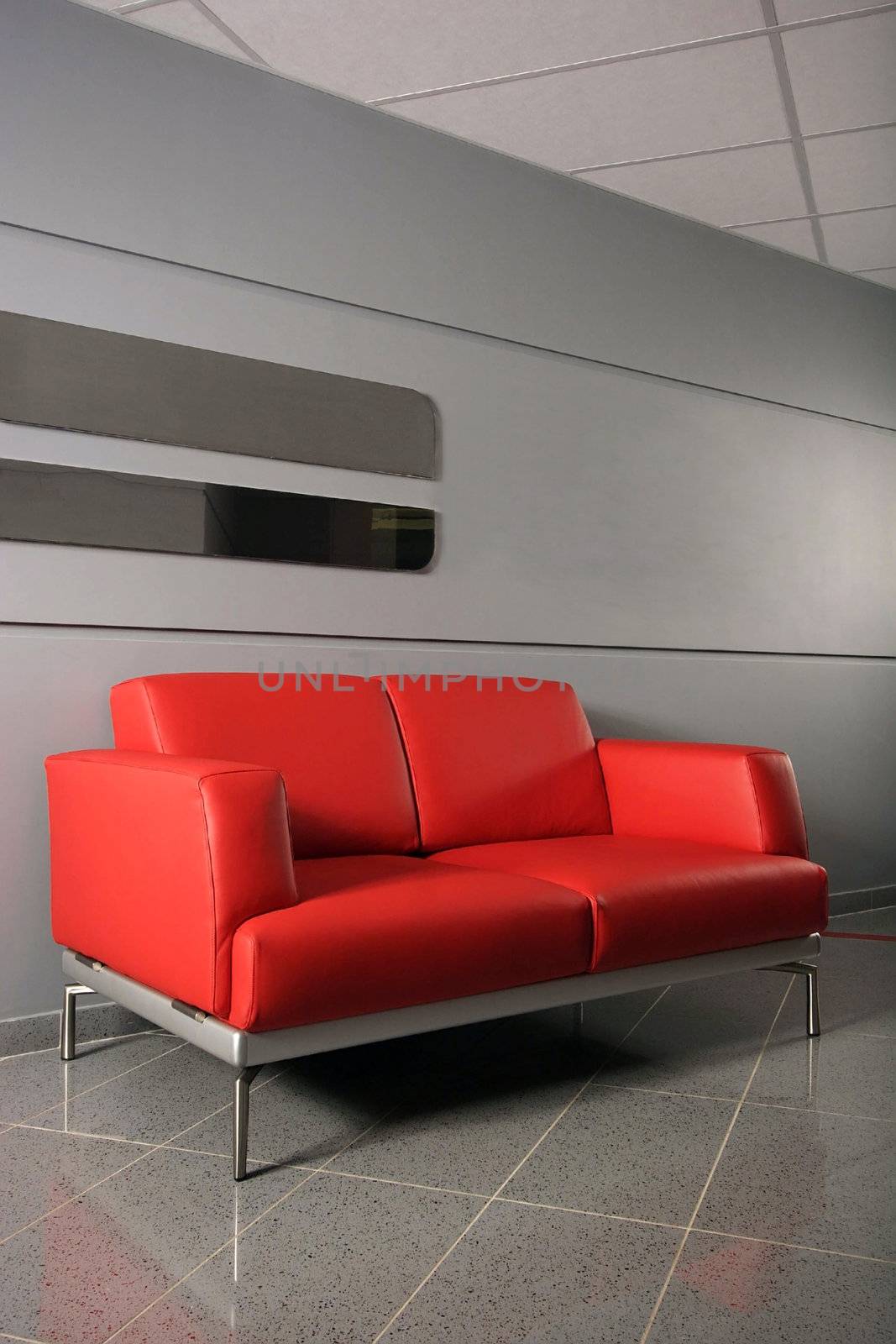 Lobby with armchairs at large office