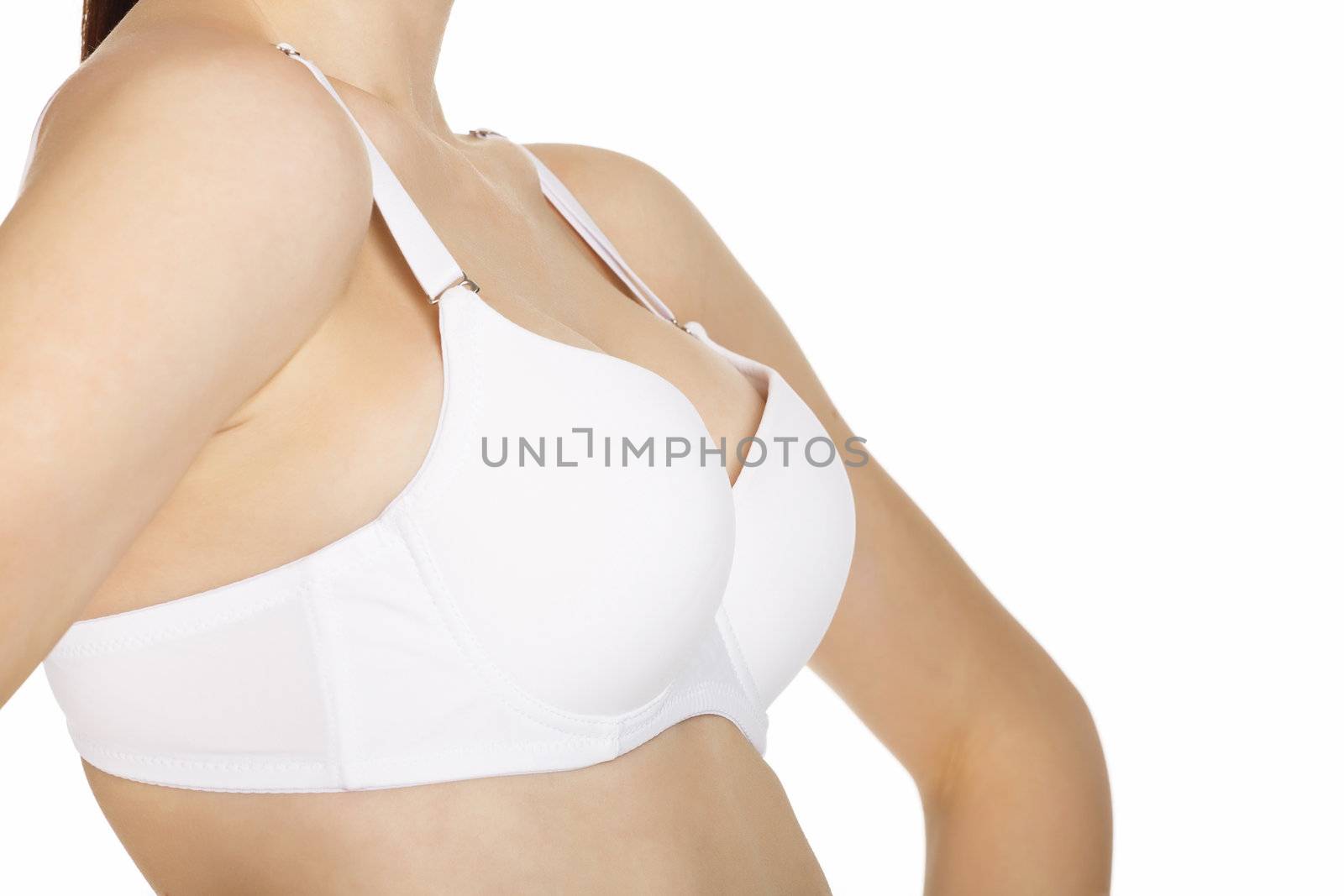 Woman breast in uplift on a white background by Nobilior