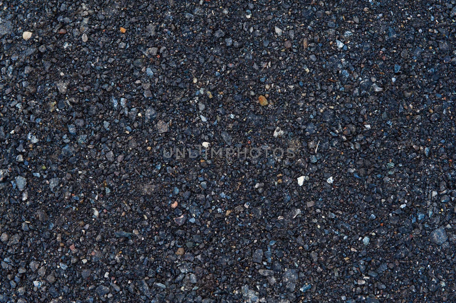 Fresh asphalt texture with stones for use as background
