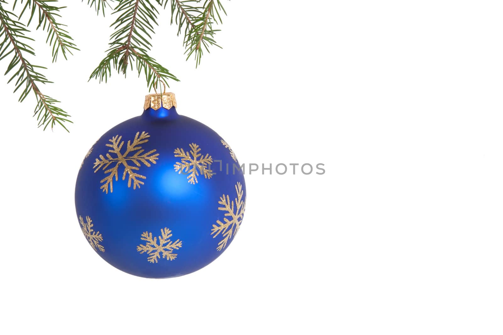 Blue christmas ball on green fir branch over white isolated
