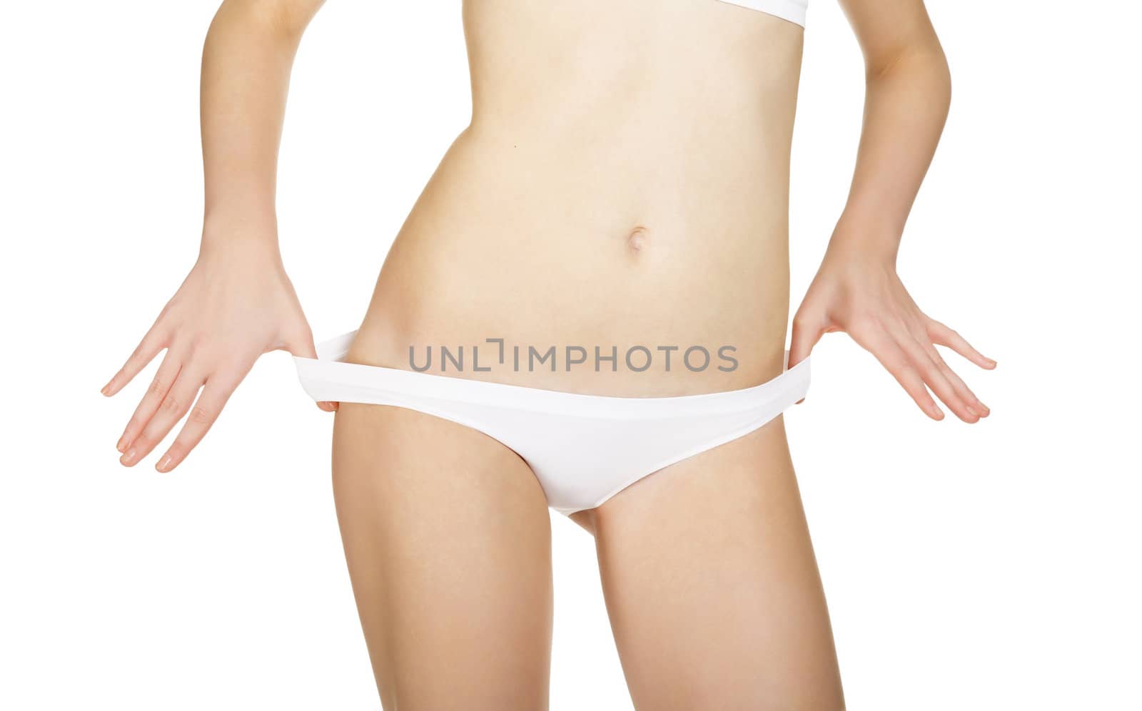 Slim tanned woman's body. Isolated over white background by Nobilior