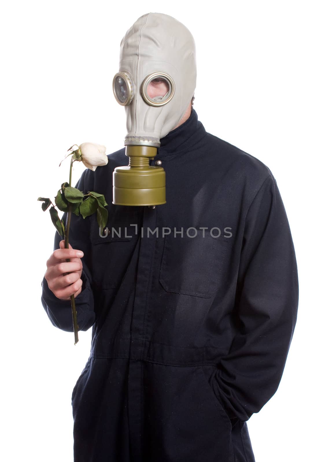 A guy wearing a gas mask is holding a wilting rose, isolated against a white background