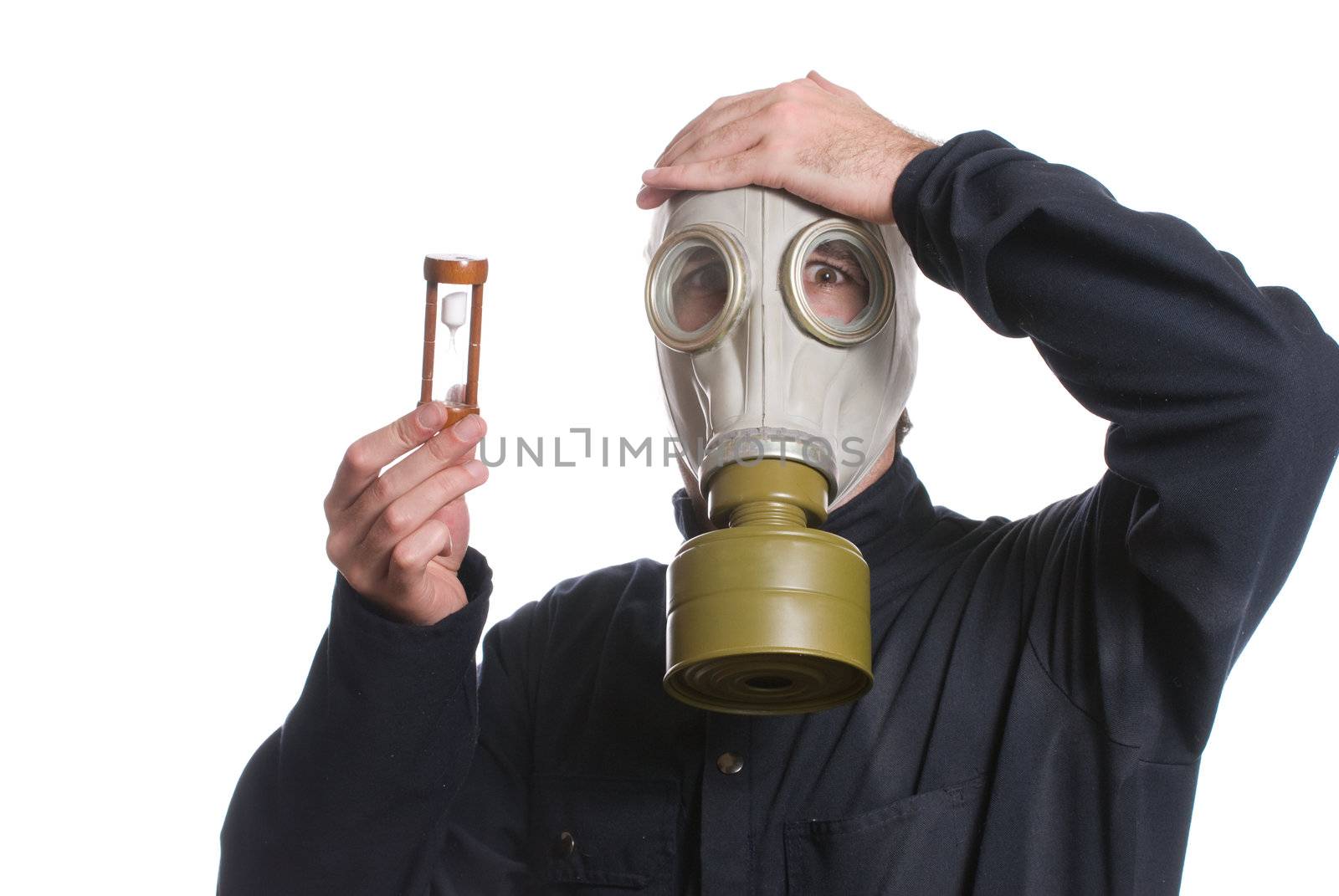 Concept image of the environment running out of time featuring a man wearing a gas mask holding an hour glass, isolated against a white background
