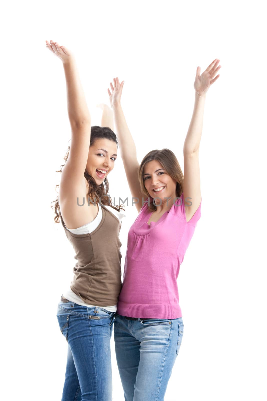 Two beautiful and happy young women isolated over white background