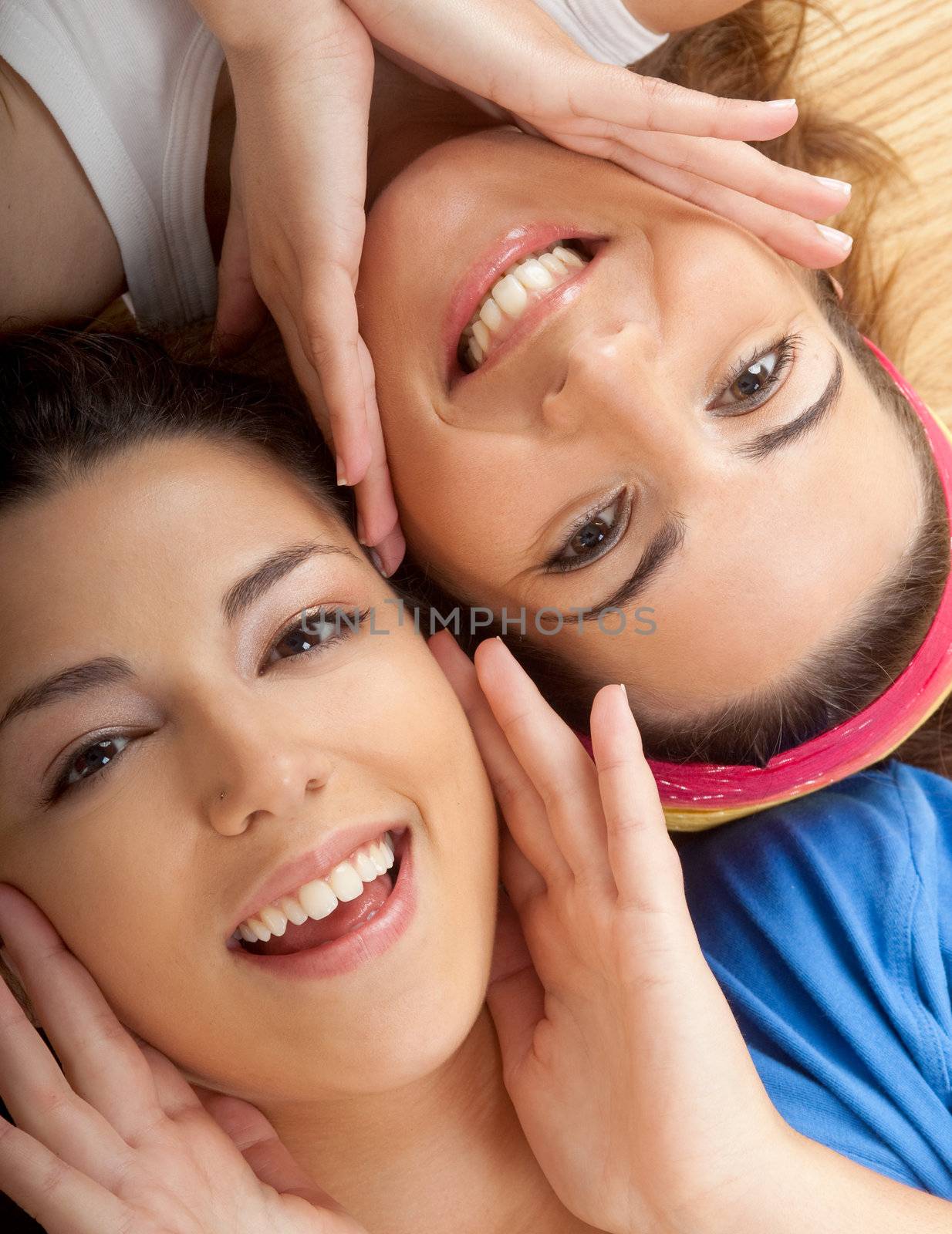 Portraits of two beautiful young women on the floor