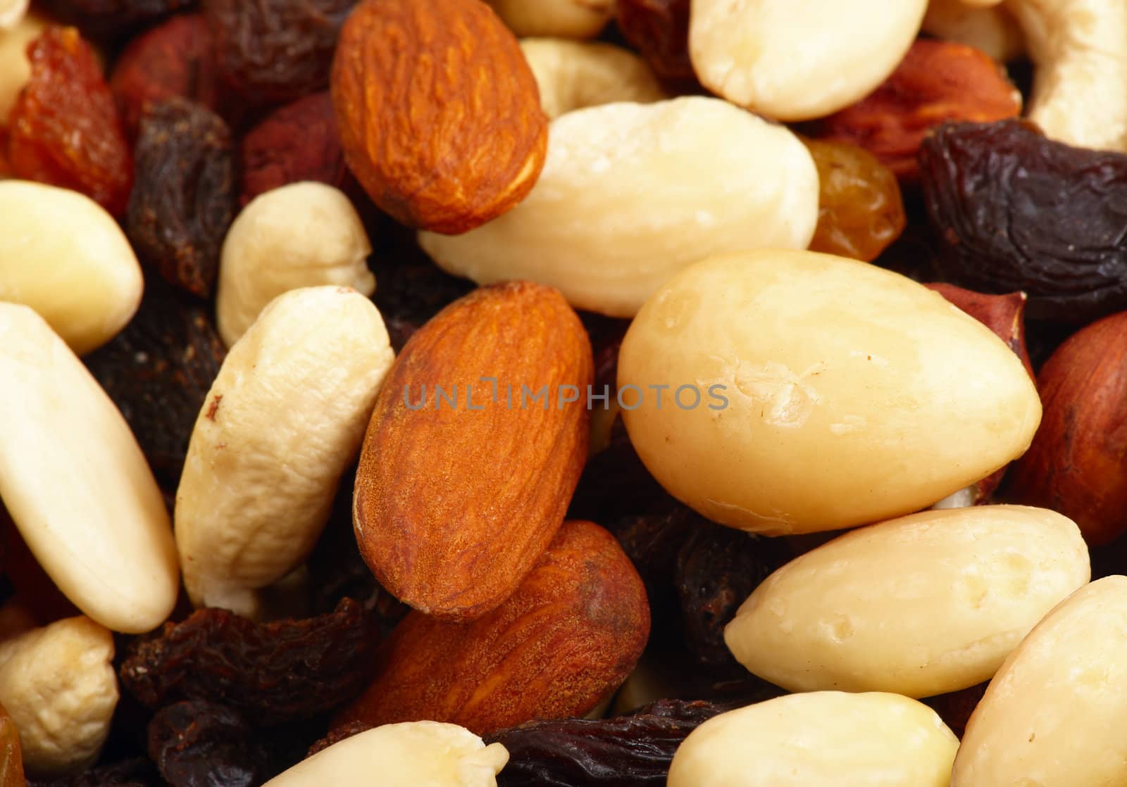 Scattered miscellaneous nuts on white background. Close-up