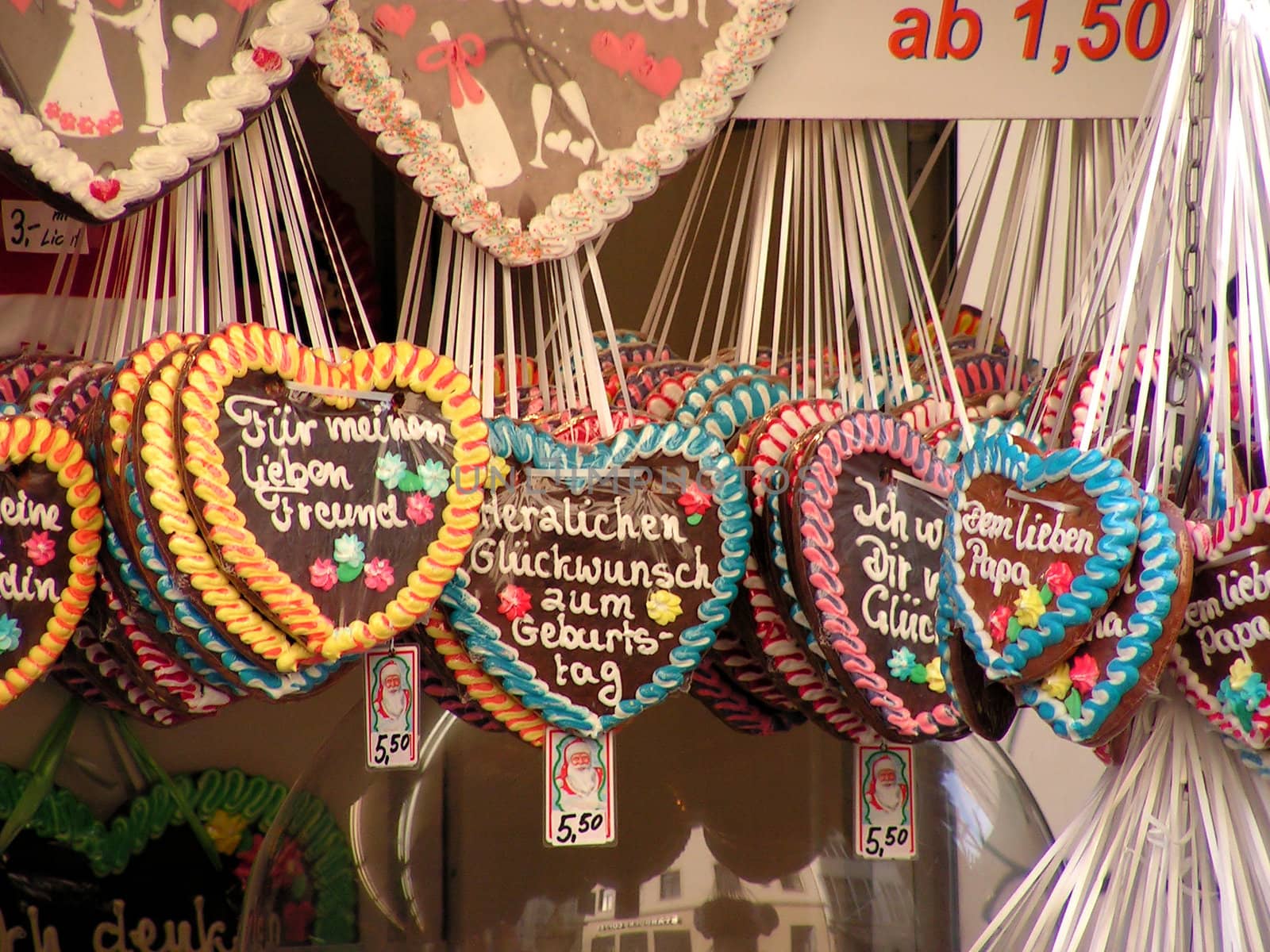 Colorful traditional gingerbread hearts on christmas market
