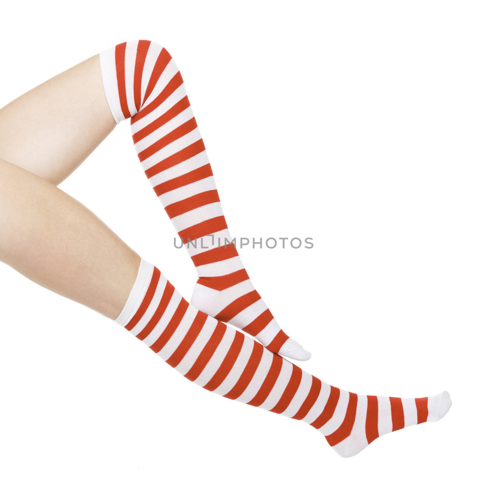 woman legs in color red socks isolated on white by Nobilior
