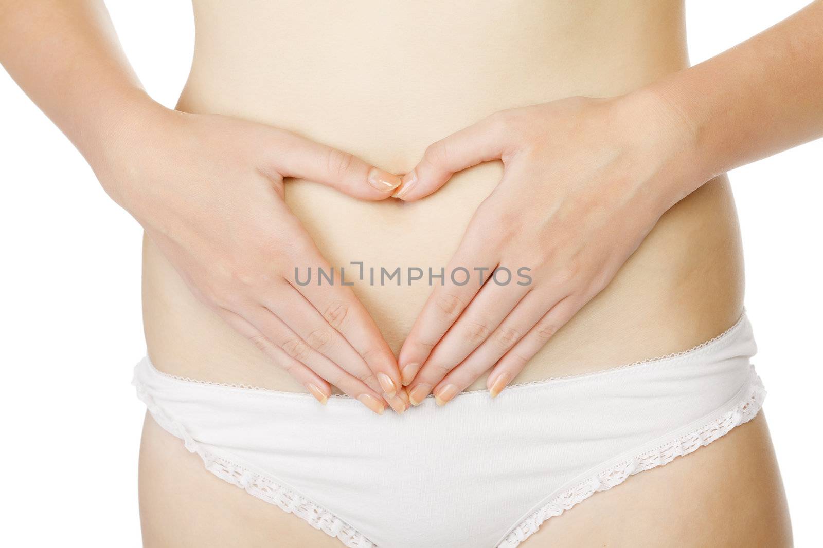 woman in white panties making heart shape with her hands on her belly, isolated on white background