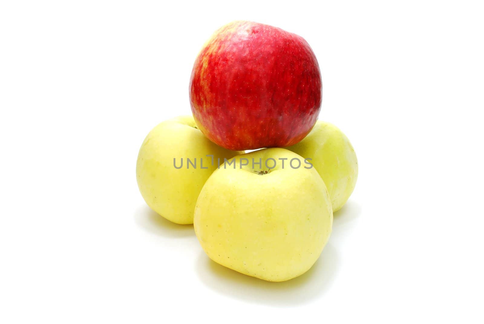 Red Apple over Three Yellow Apples Isolated on White Background