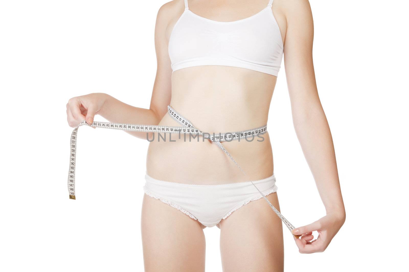 Woman measuring size of her waist with a tape measure. Isolated on white background.