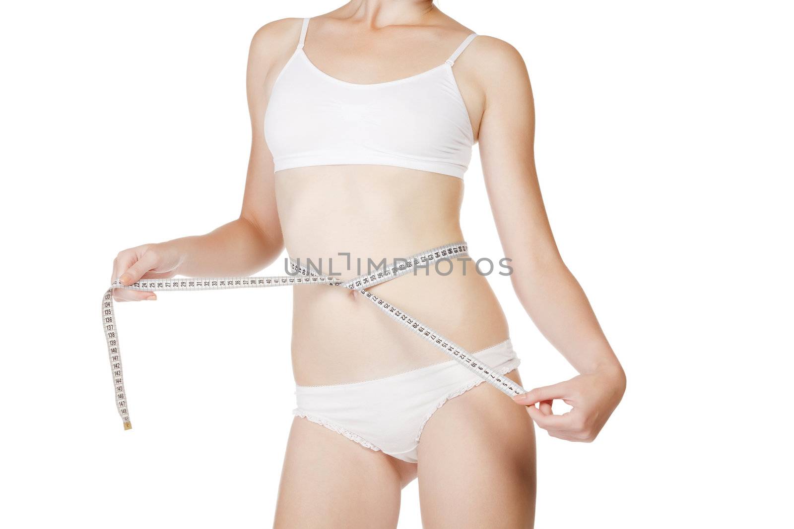 Woman measuring size of her waist with a tape measure by Nobilior