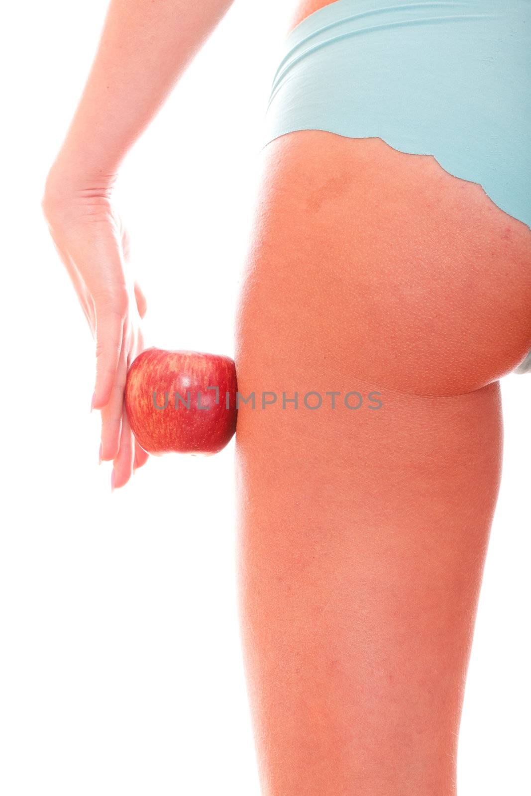 Perfect female figure and red apple