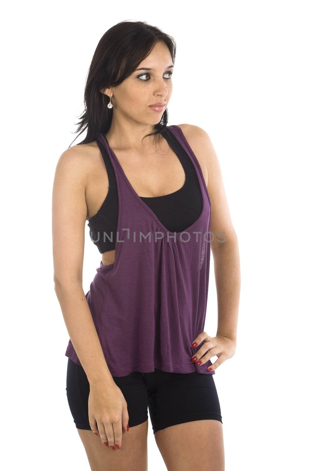 A sexy young hispanic woman wearing a gym outfit, isolated on a white background.