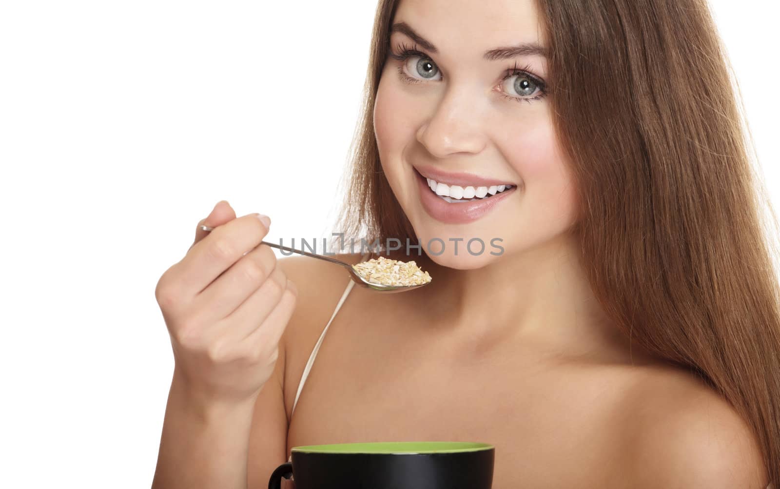 portrait of young caucasian woman eating cereals by Nobilior