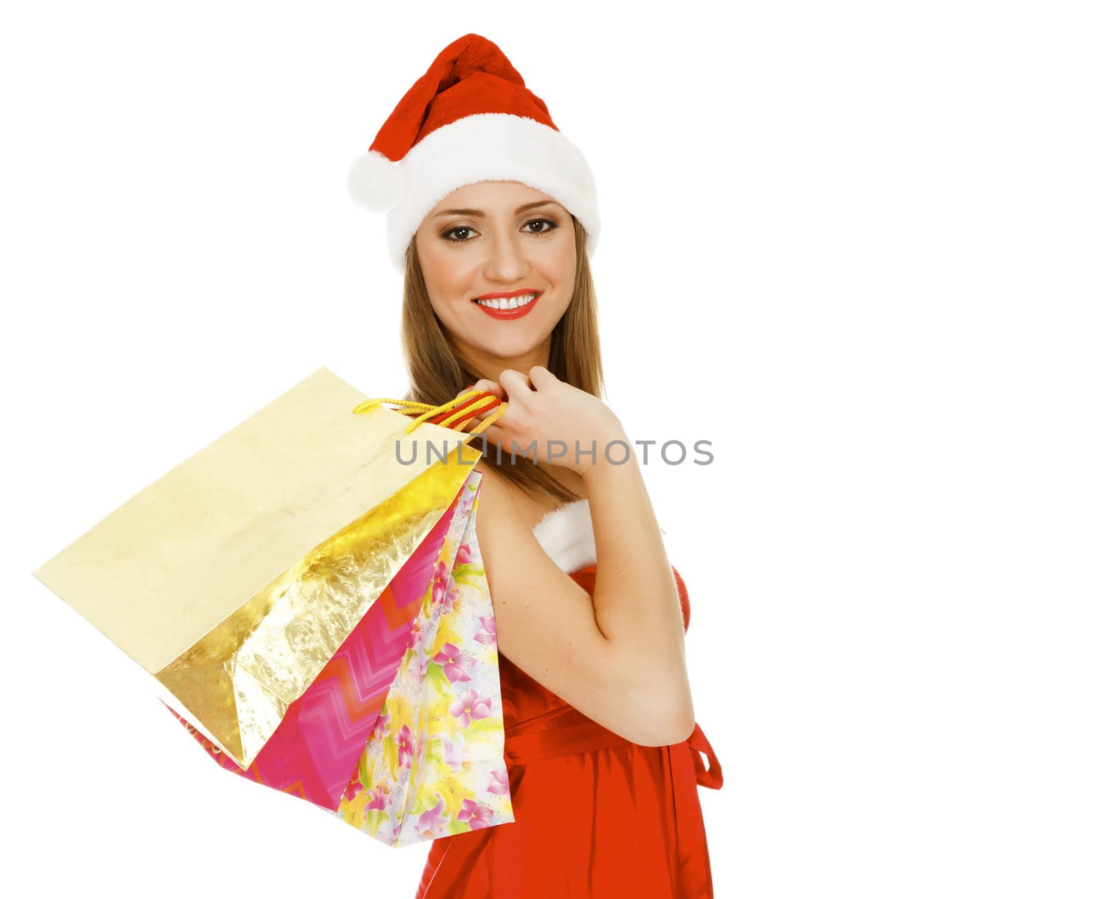 Shopping Christmas woman smiling. Isolated over white background by Nobilior