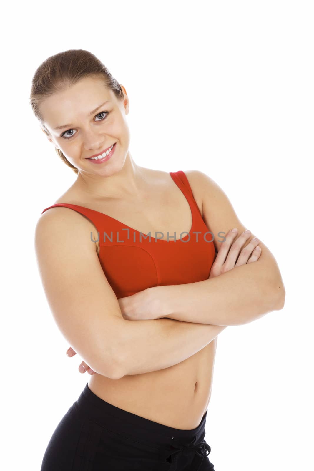 Smiling young sporty woman. Isolated over white background
