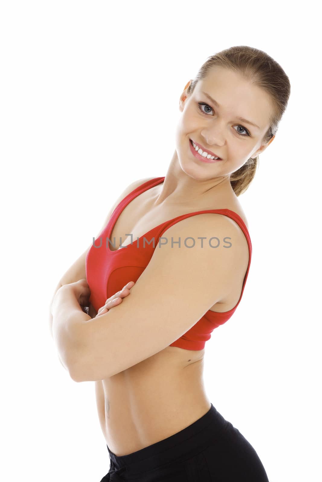 Smiling young sporty woman. Isolated over white background by Nobilior