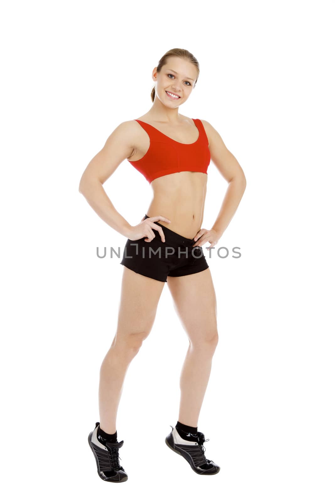 Smiling young sporty muscular woman. Isolated over white backgro by Nobilior