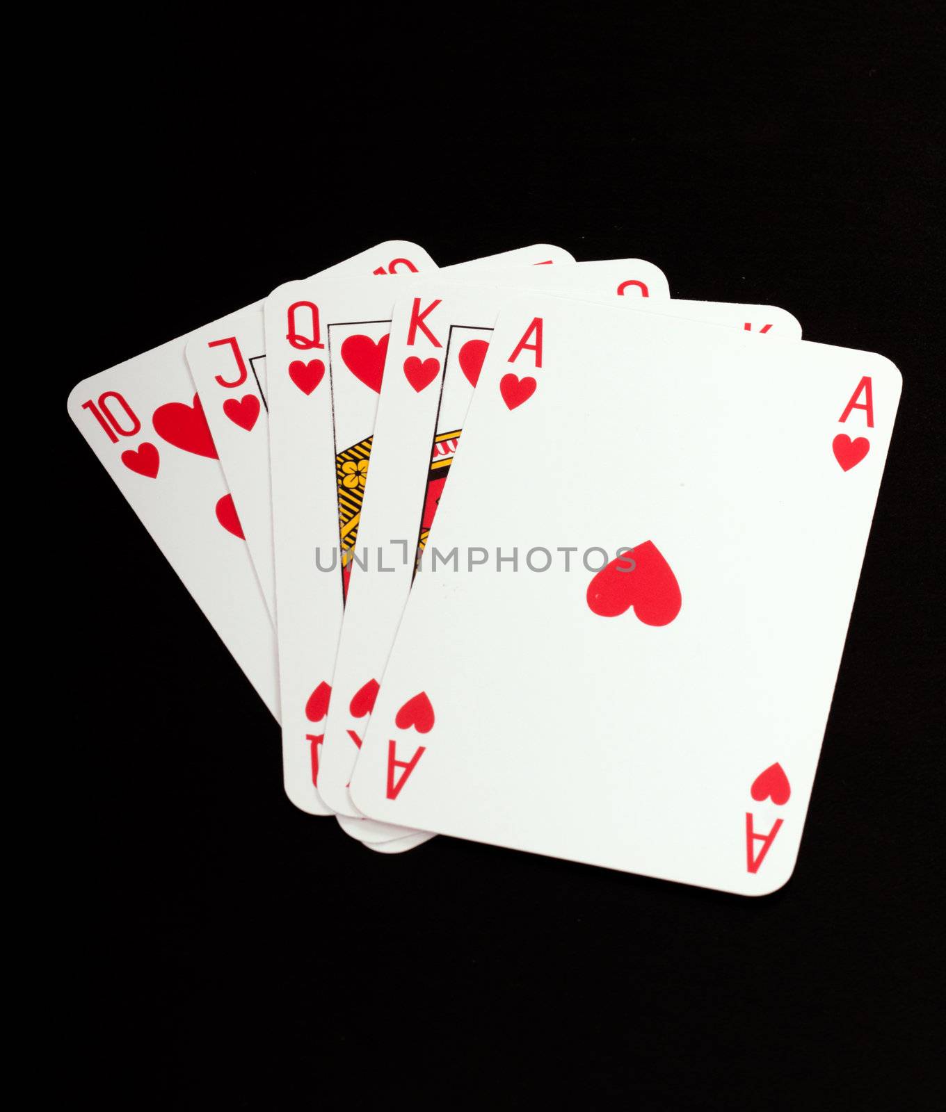 A royal straight flush playing cards poker hand in hearts