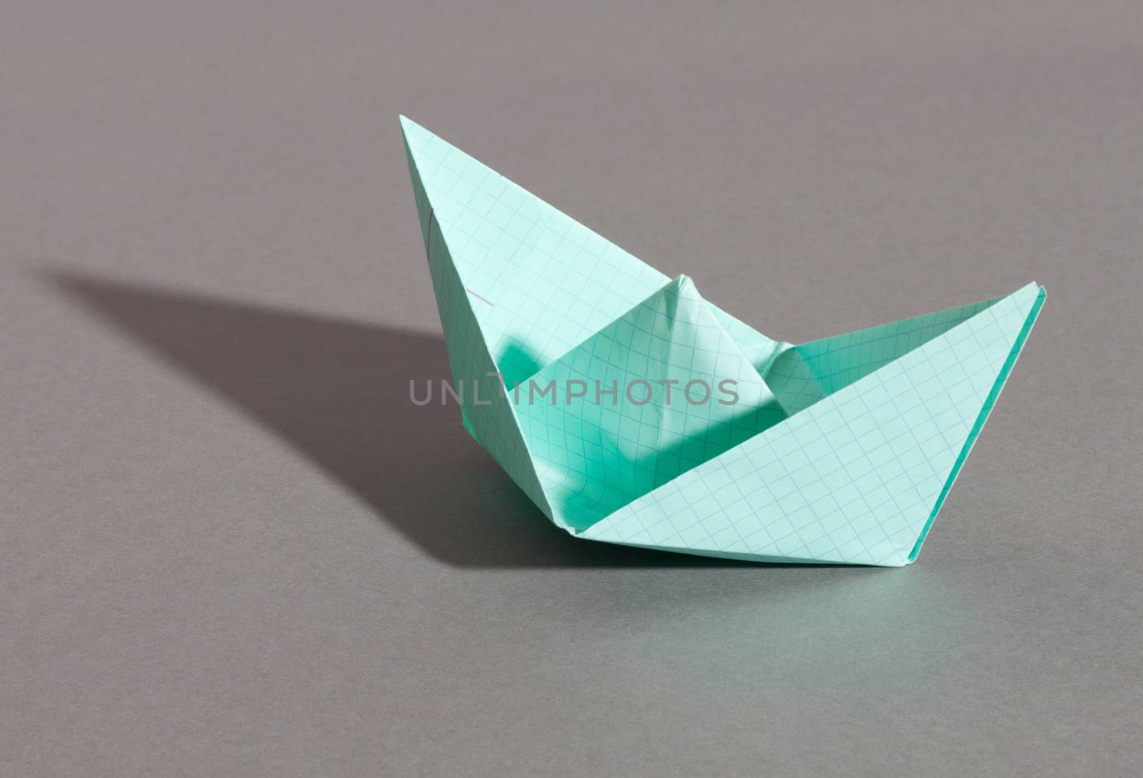 Paper ship, photo on the grey background