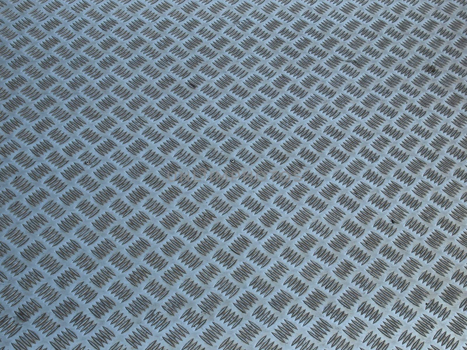 Diamond steel plate useful as a background