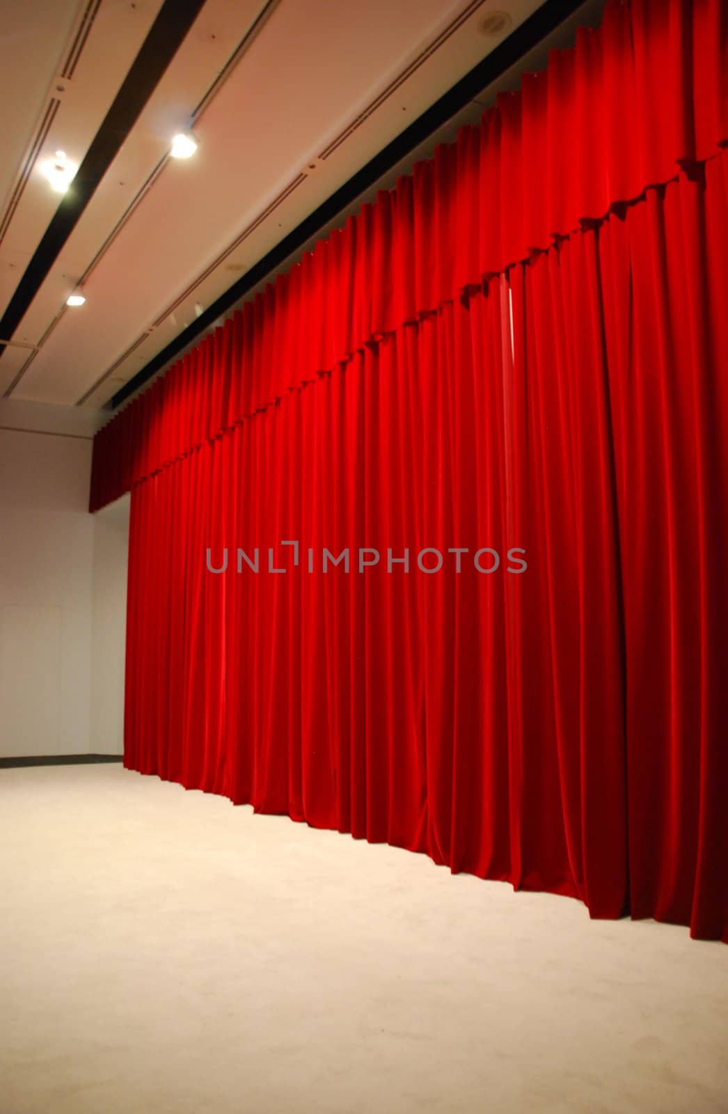 Red draped theater stage curtains with lights by luissantos84