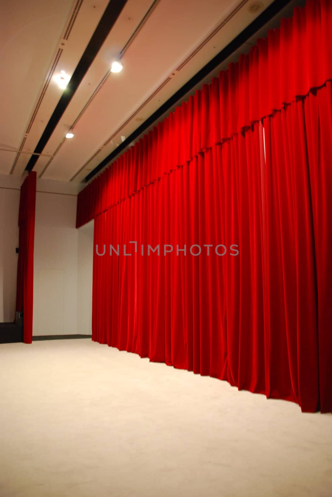 Red draped theater stage curtains with lights by luissantos84