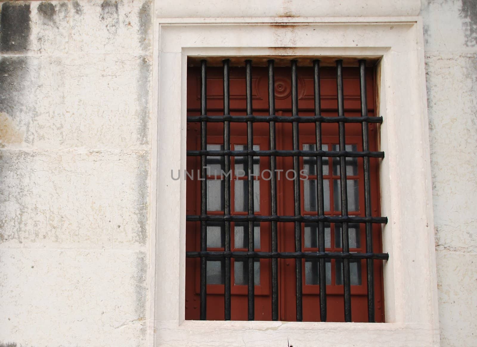 Window with bars of a medieval building by luissantos84