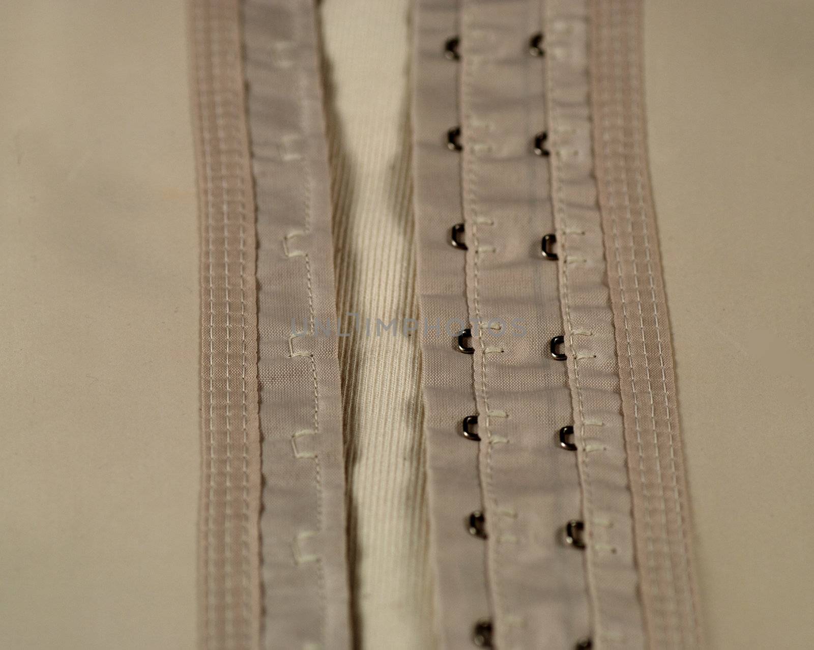 eyelets and hooks used in girdles and in corsets