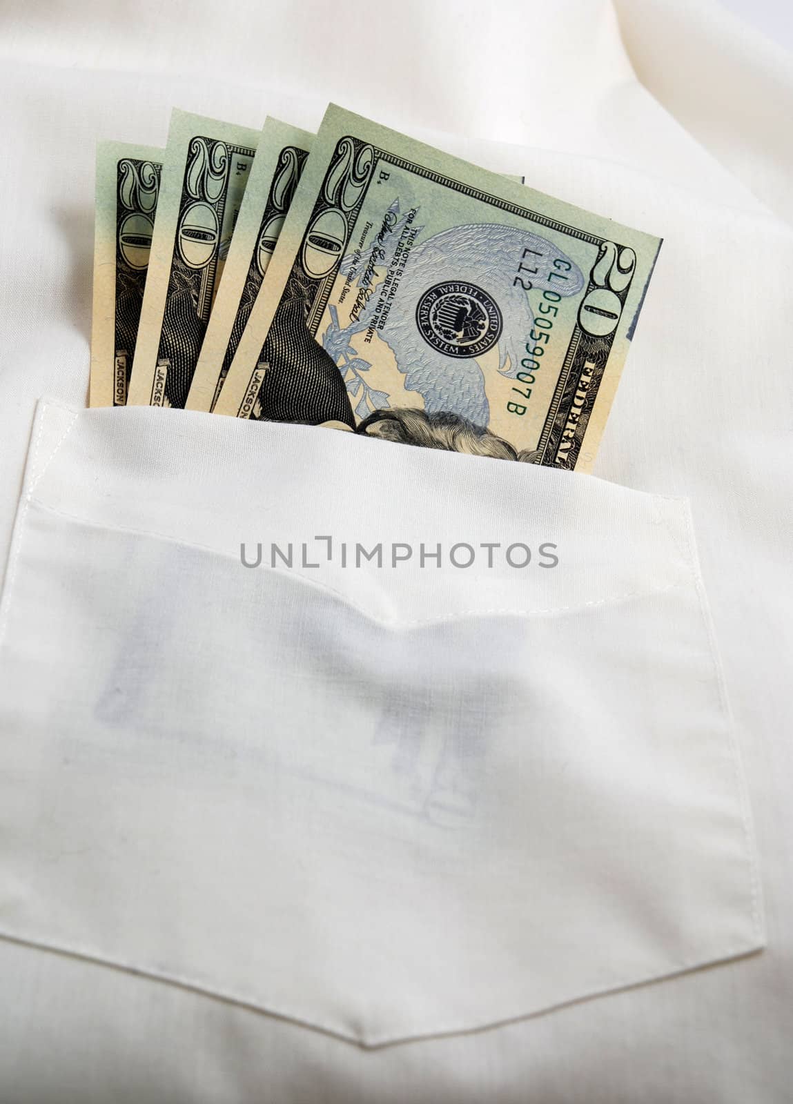  pictures of several twenty dollar bills in the pocket of a shirt