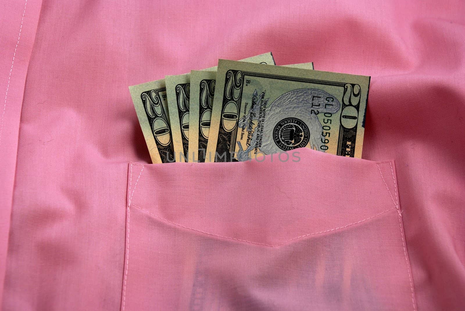  pictures of several twenty dollar bills in the pocket of a shirt