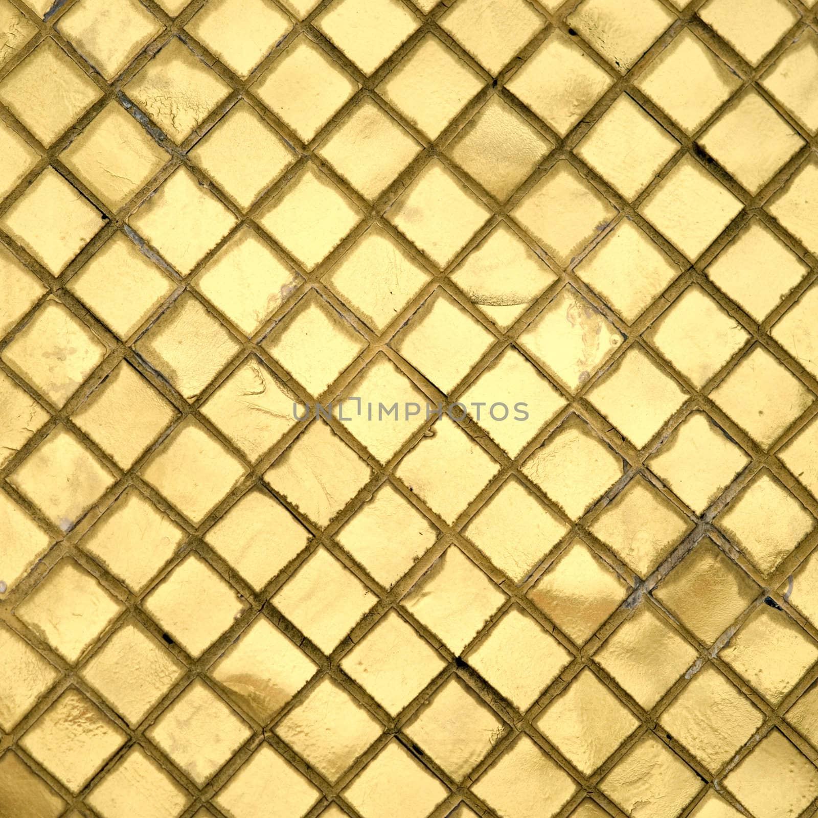 The wall with golden mosaic in Grand palace, Bangkok, Thailand 