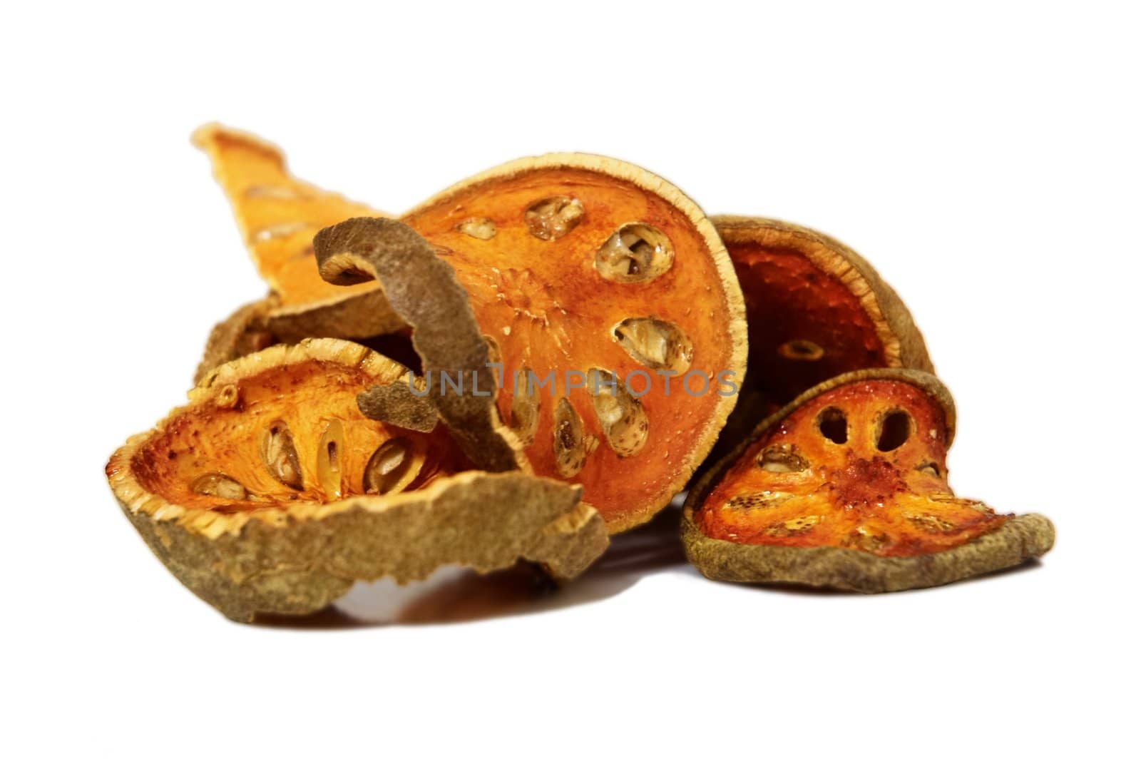 Bale Fruit dried tee. Isolated on white. Bale fruit is tropical fruit with hard exterior cover. The fruit has medicinal value for digestive system. Extensively consumed in rural India and Thailand.