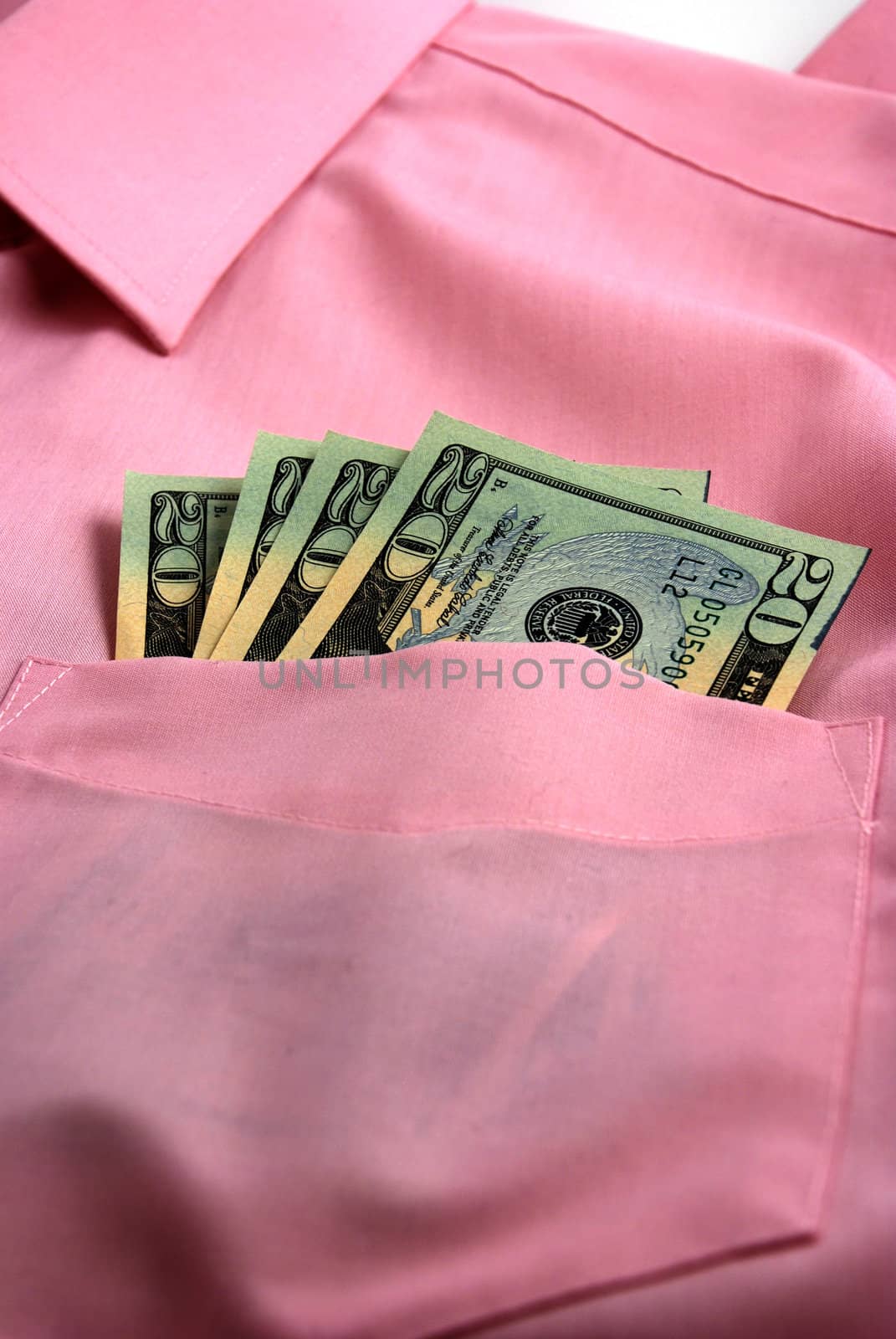  pictures of several twenty dollar bills in the pocket of a shirt