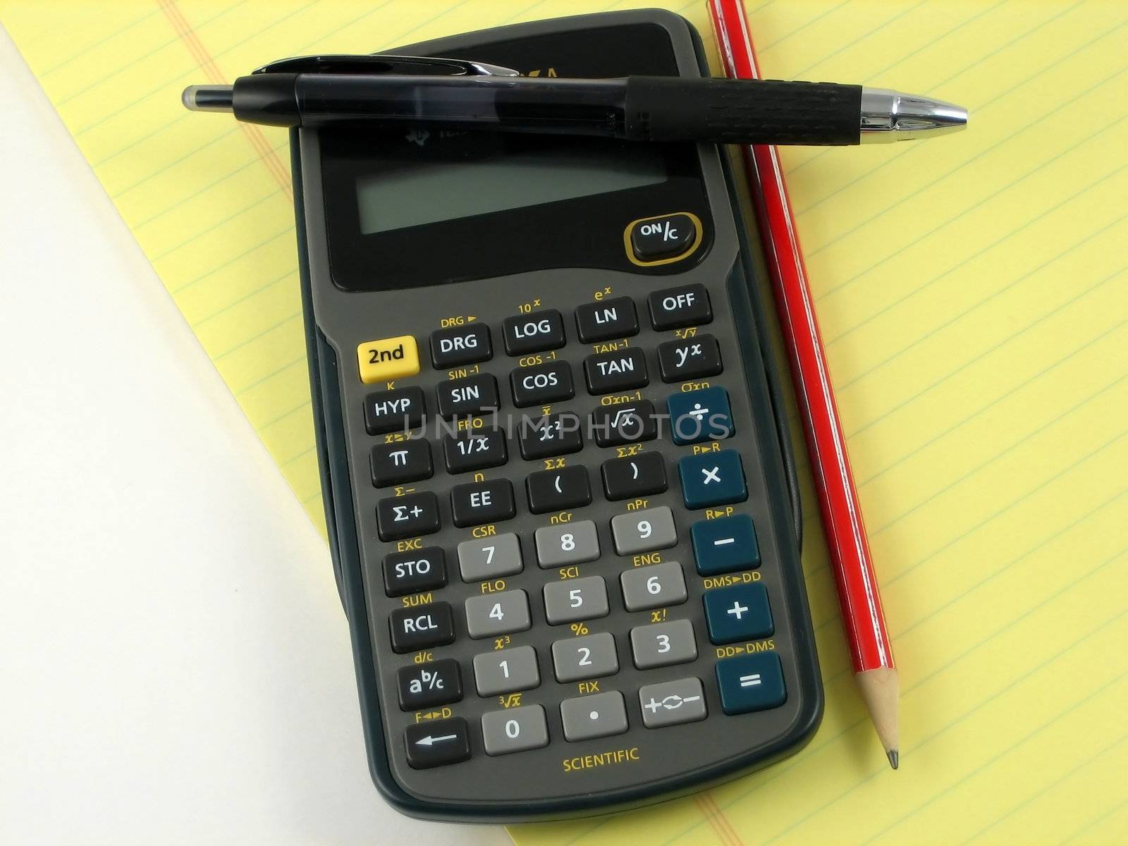 Checkbook, notepad and calculator used to make financial decissions