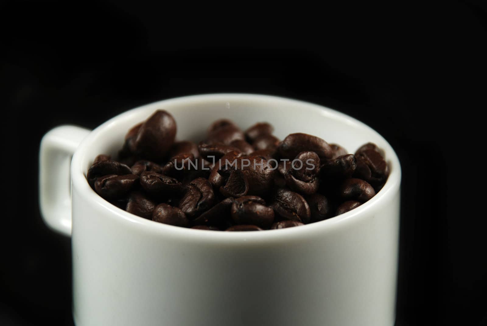 Coffee beans and cup by albln