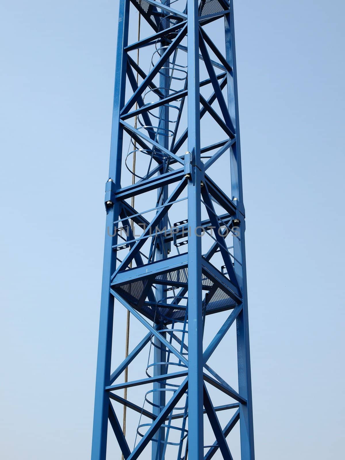 Detail of a tower crane over blue sky