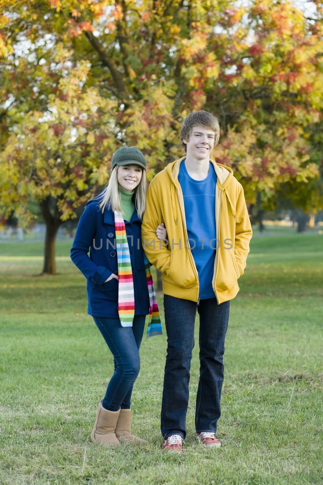Portrait of a Brother and Sister Standing Together in a Park
