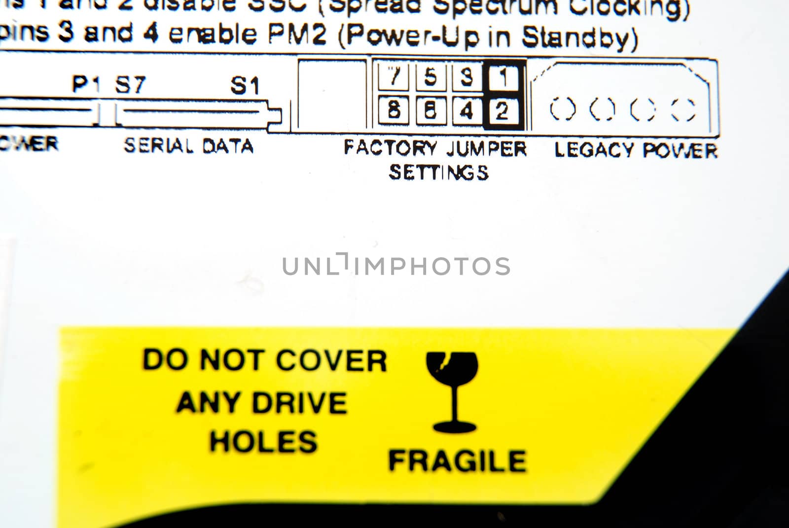 Pictures of the warning label in a computer hard drive