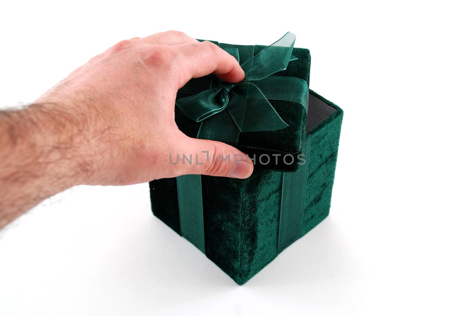 Green gift box with a laced up bow