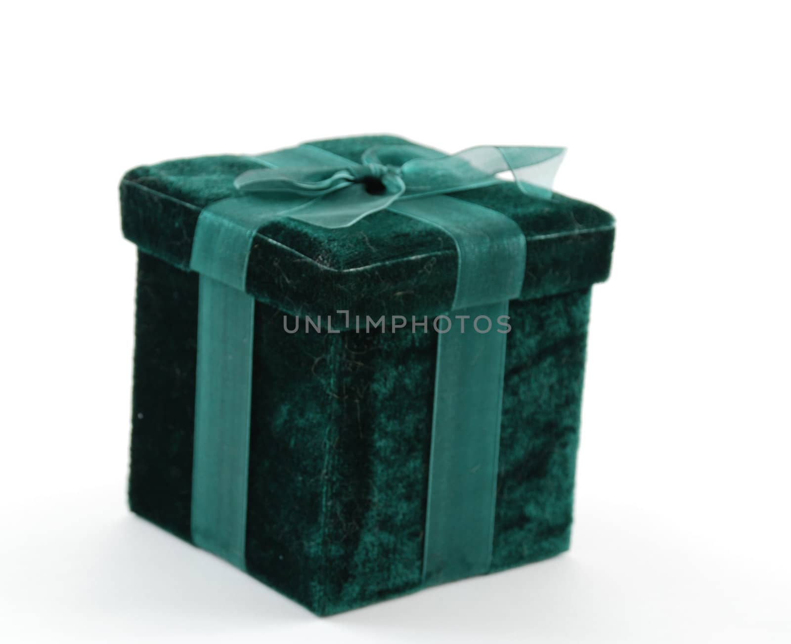 Green gift box with a laced up bow