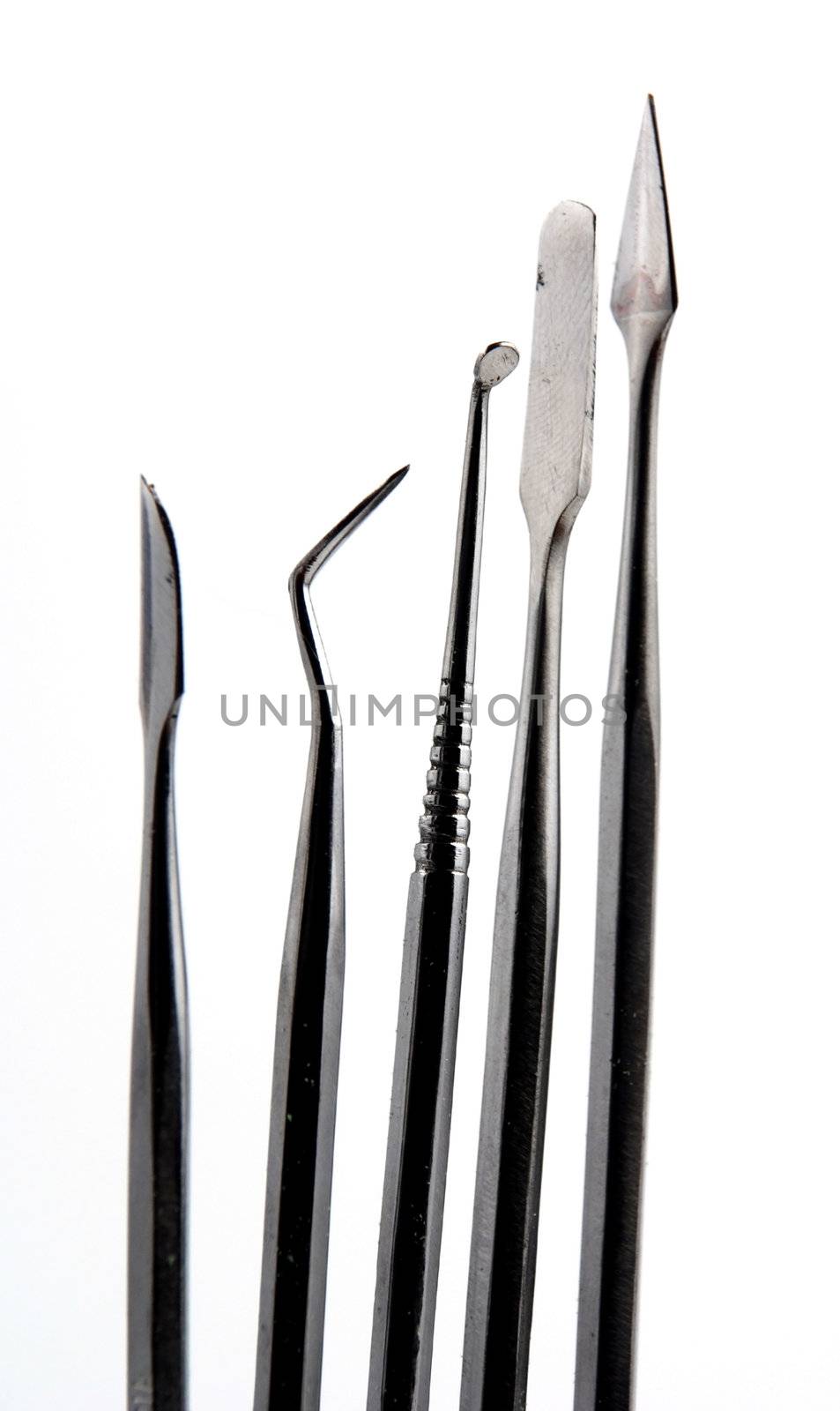 Stock pictures of metal dental instruments used to work on patients