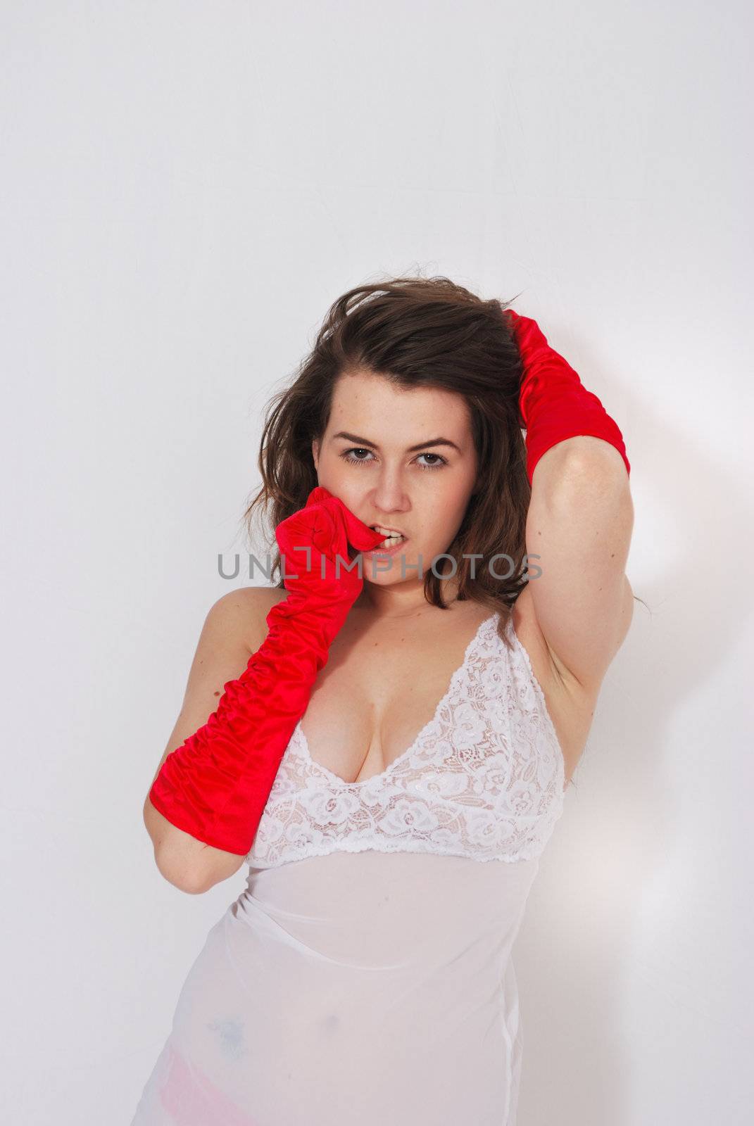 sexy girl posing in red satin gloves