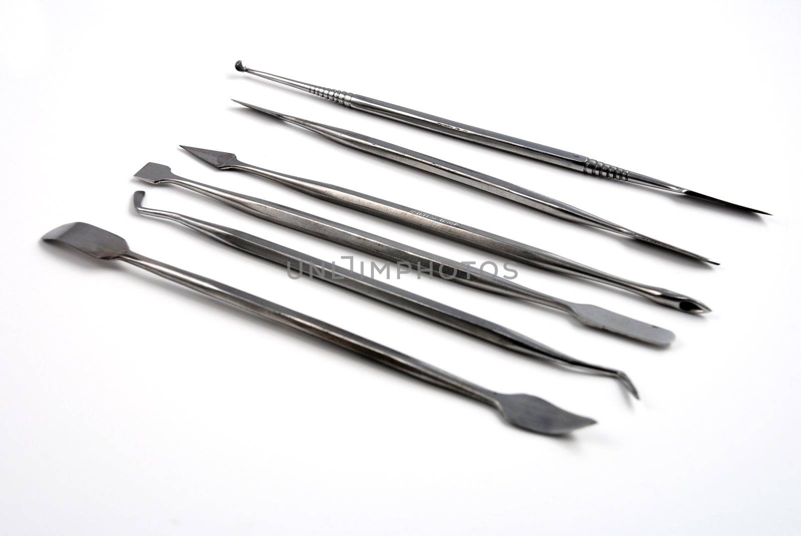 Stock pictures of metal dental instruments used to work on patients