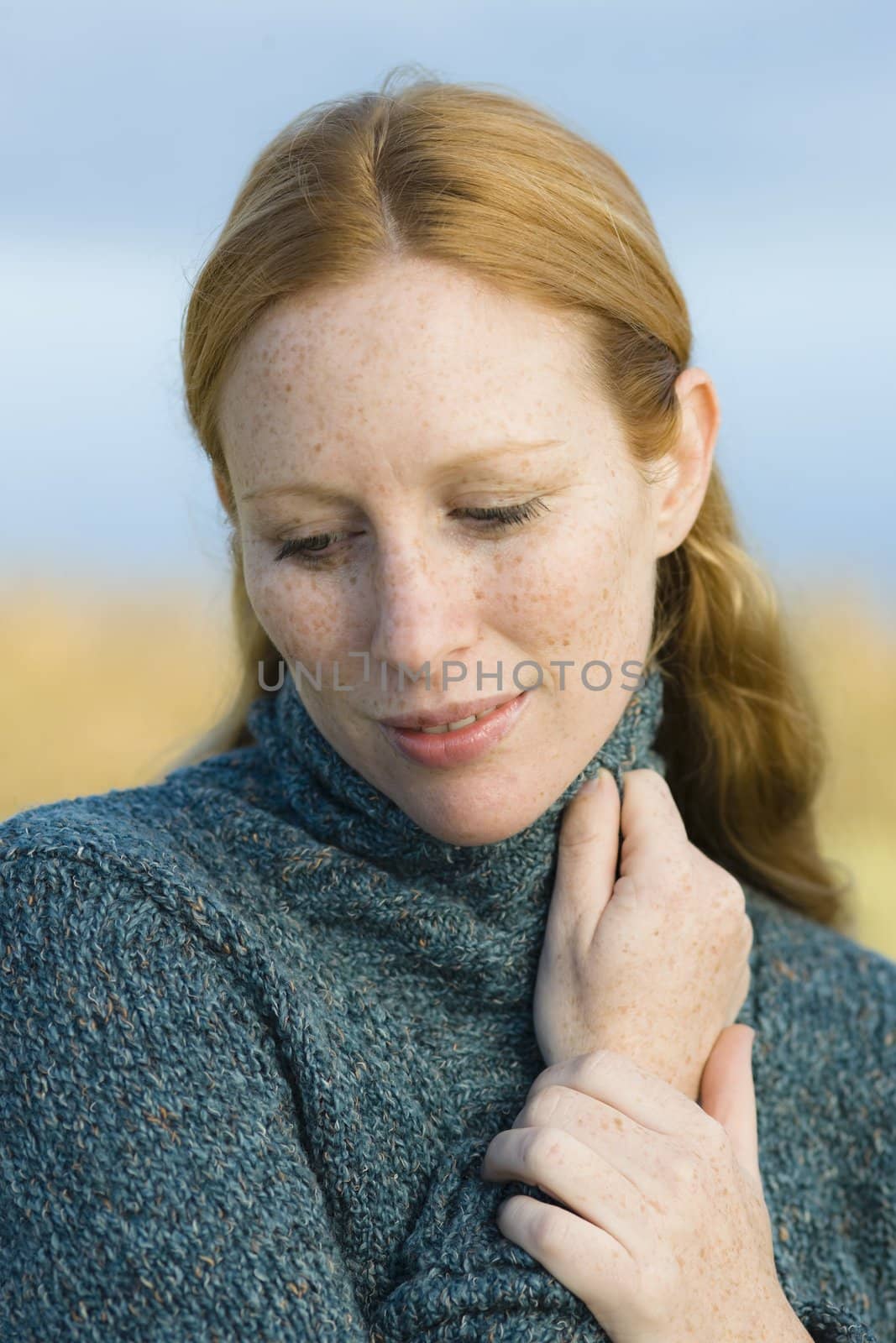 Portrait of a Pretty Redhead Woman Outdoors