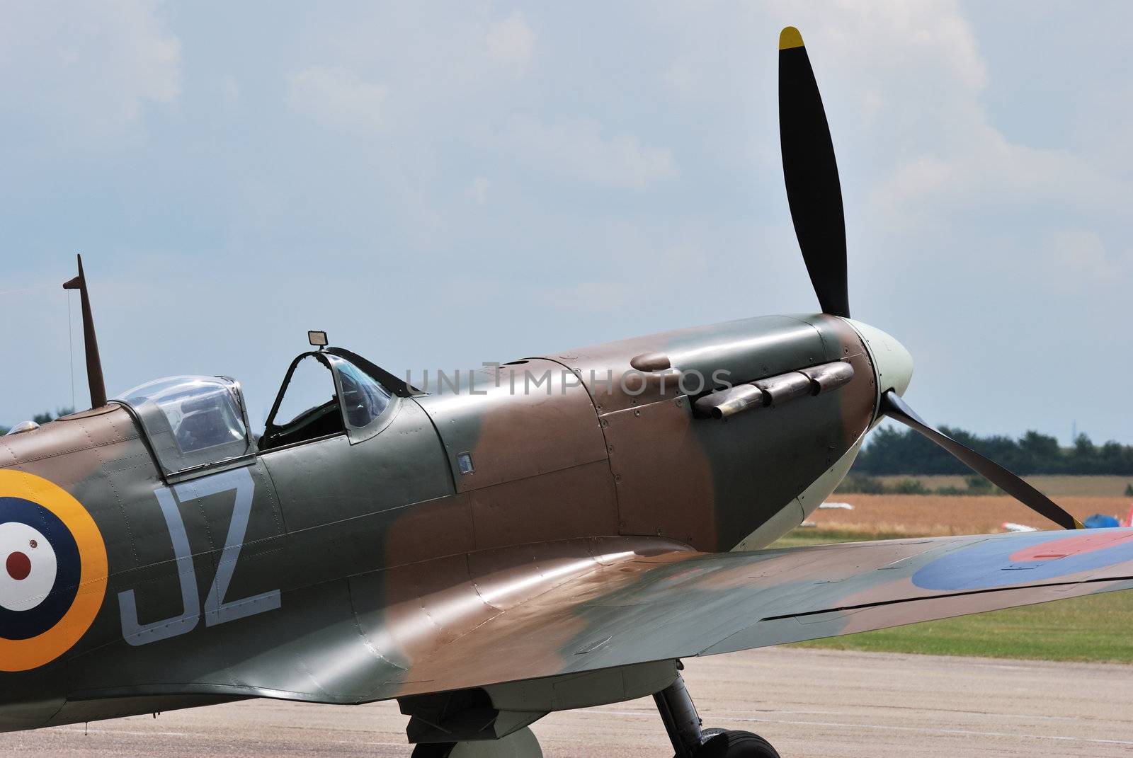front of spitfire on runway
