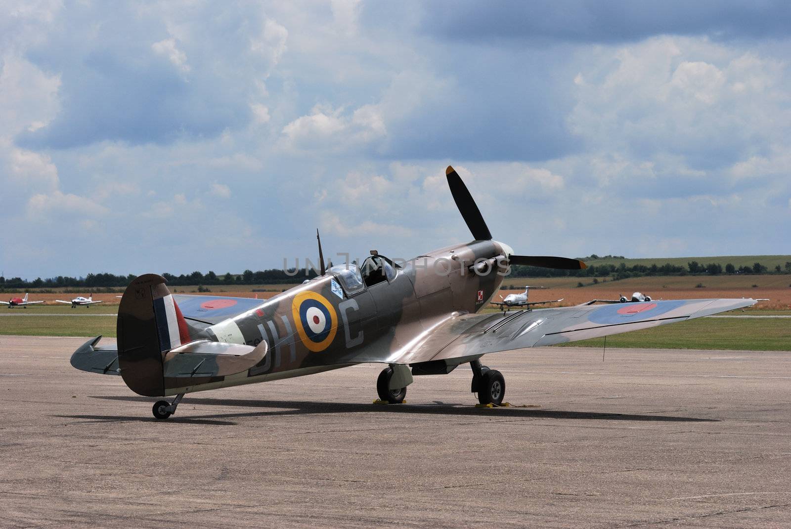 spitfire plane standing on runway