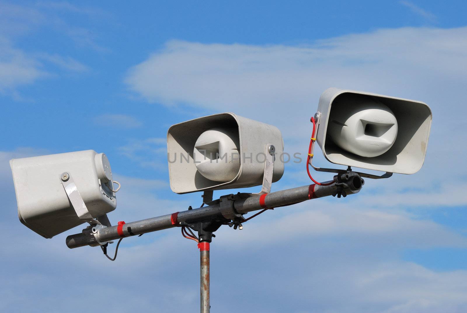 three loudspeakers on public address system