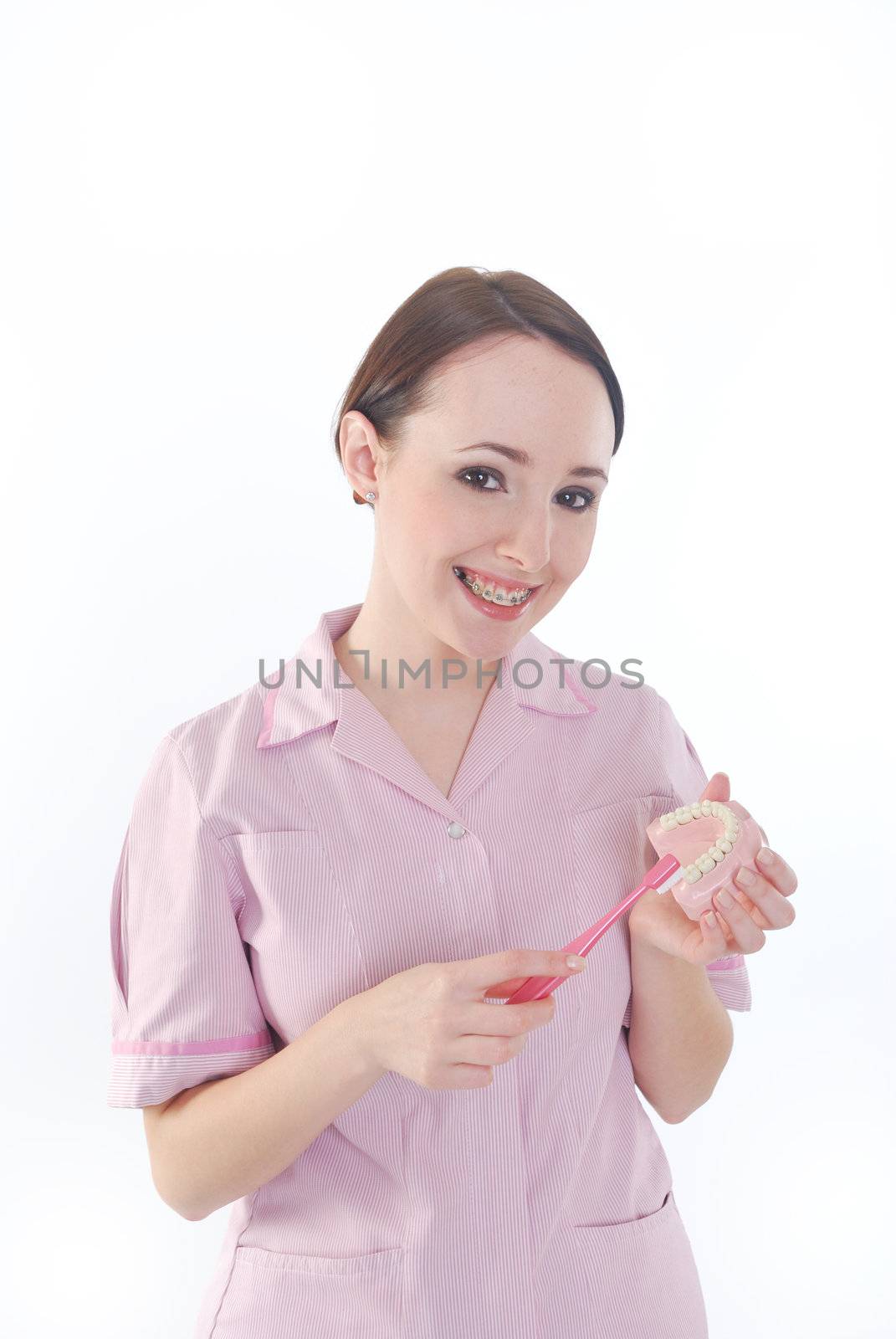 pretty girl cleaning dentures by pauws99